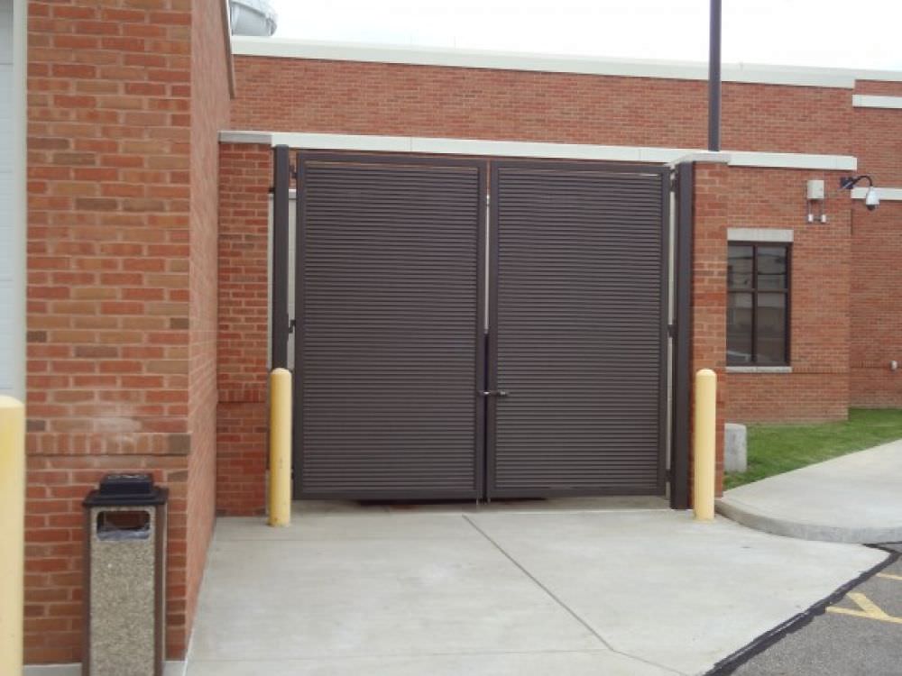 DOUBLE SWING GATES SHADOW 100 GALVANIZED STEEL FIXED LOUVER GALVANIZED AND POWDER COATED AT THE STRONGSVILLE POLICE DEPARTMENT 445